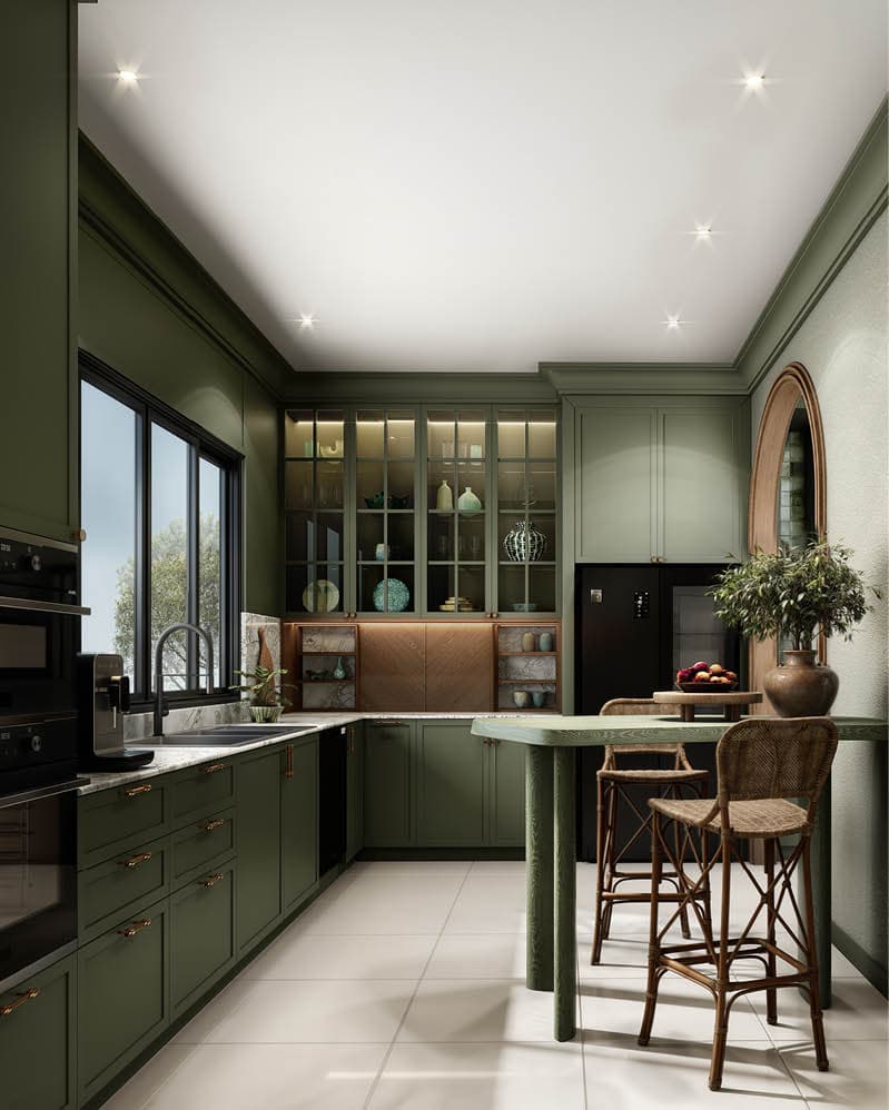 Sage green kitchen with brass details and woven stools