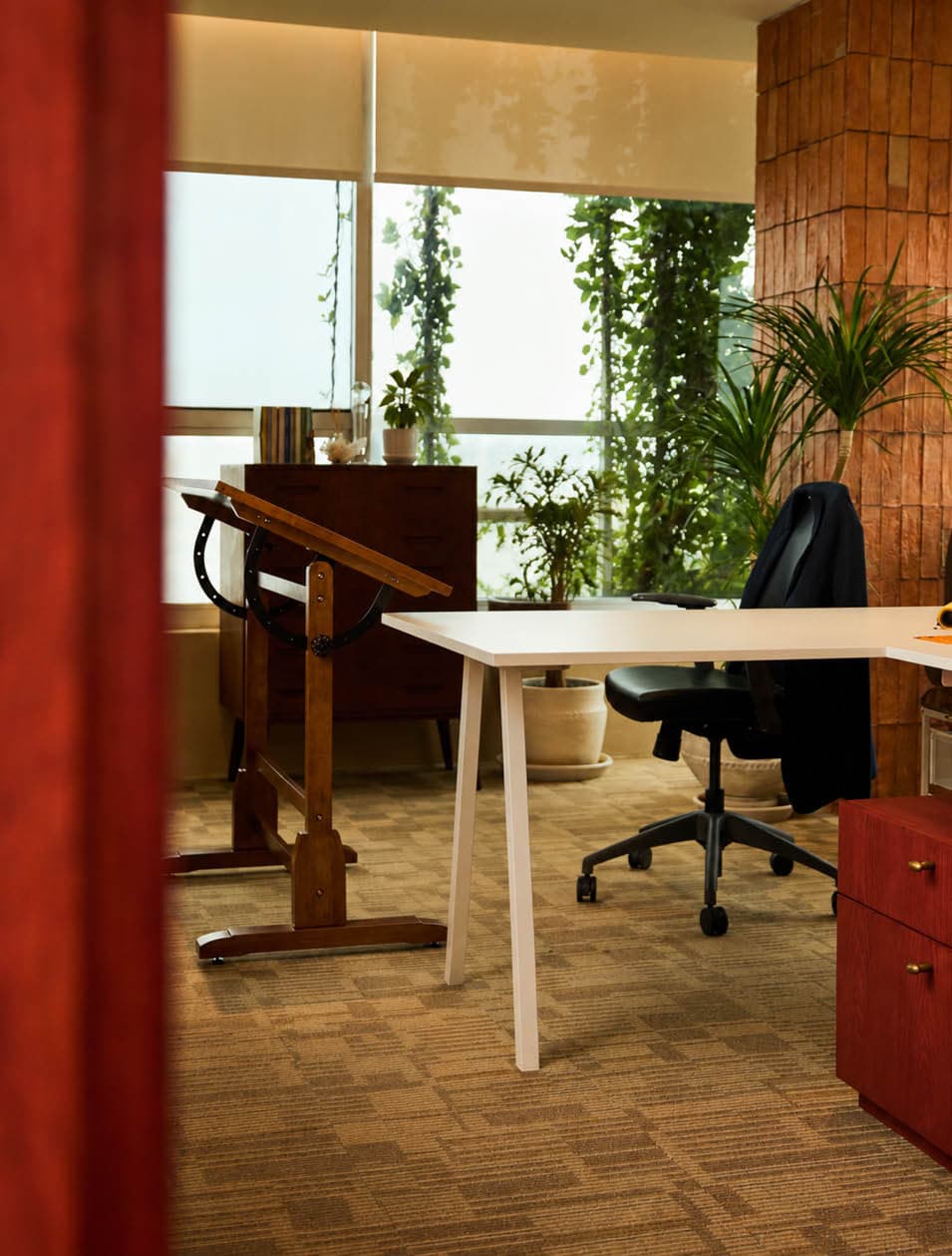 Creative director office with an antique wooden drafting table