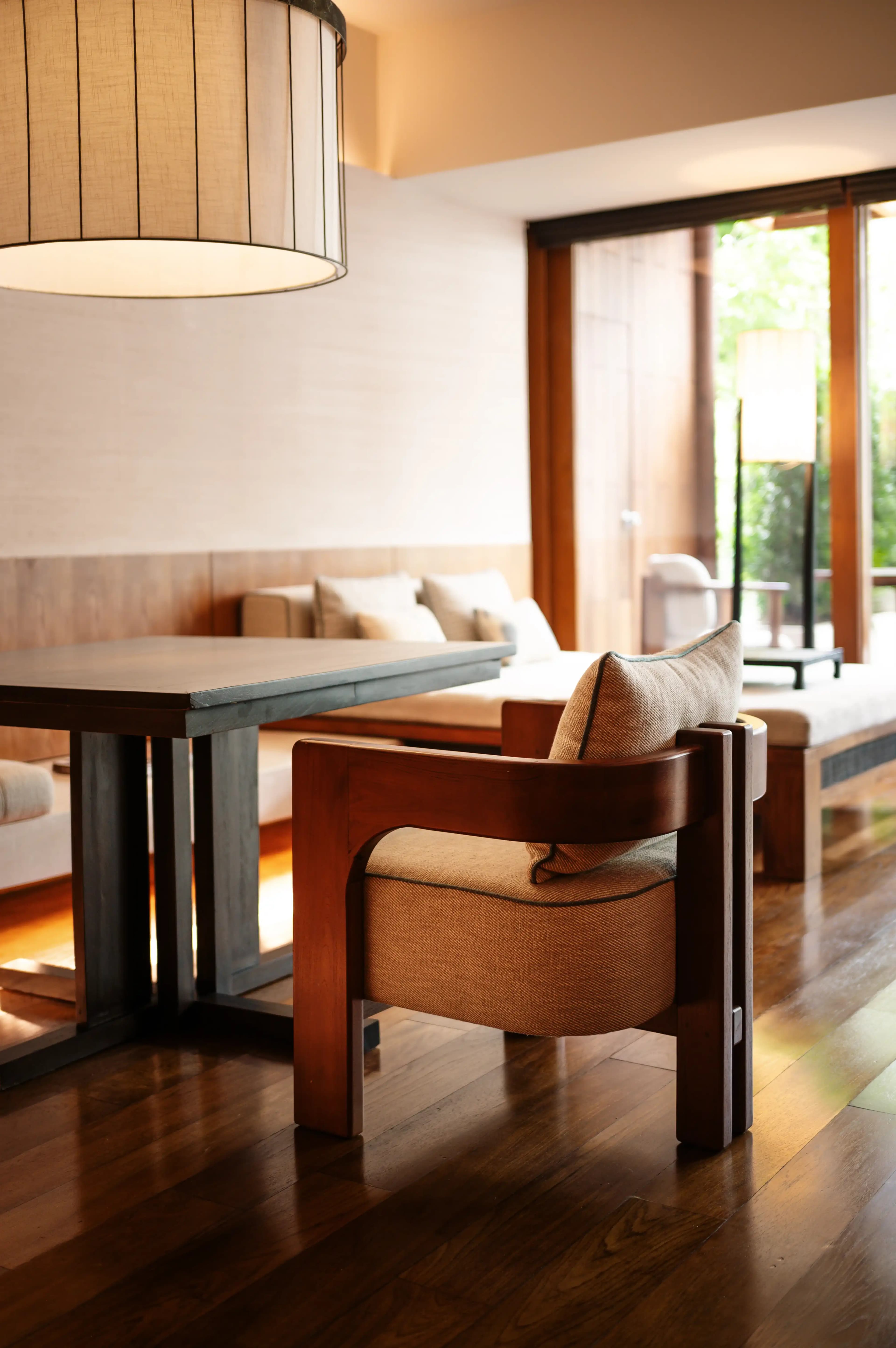 Warm light and carefully proportioned hotel furniture