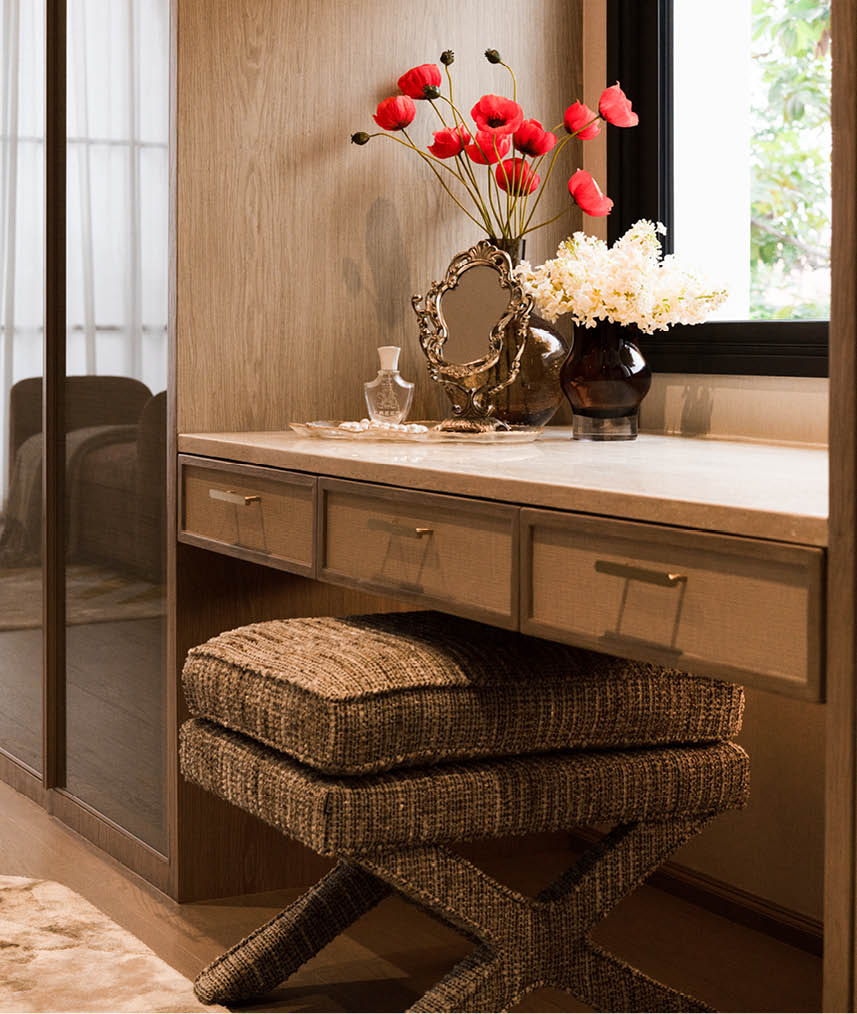 Warm timber walk-in wardrobe and dressing table