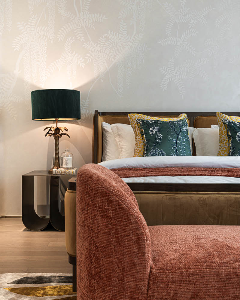 Master bedroom detail with coral lounge chair